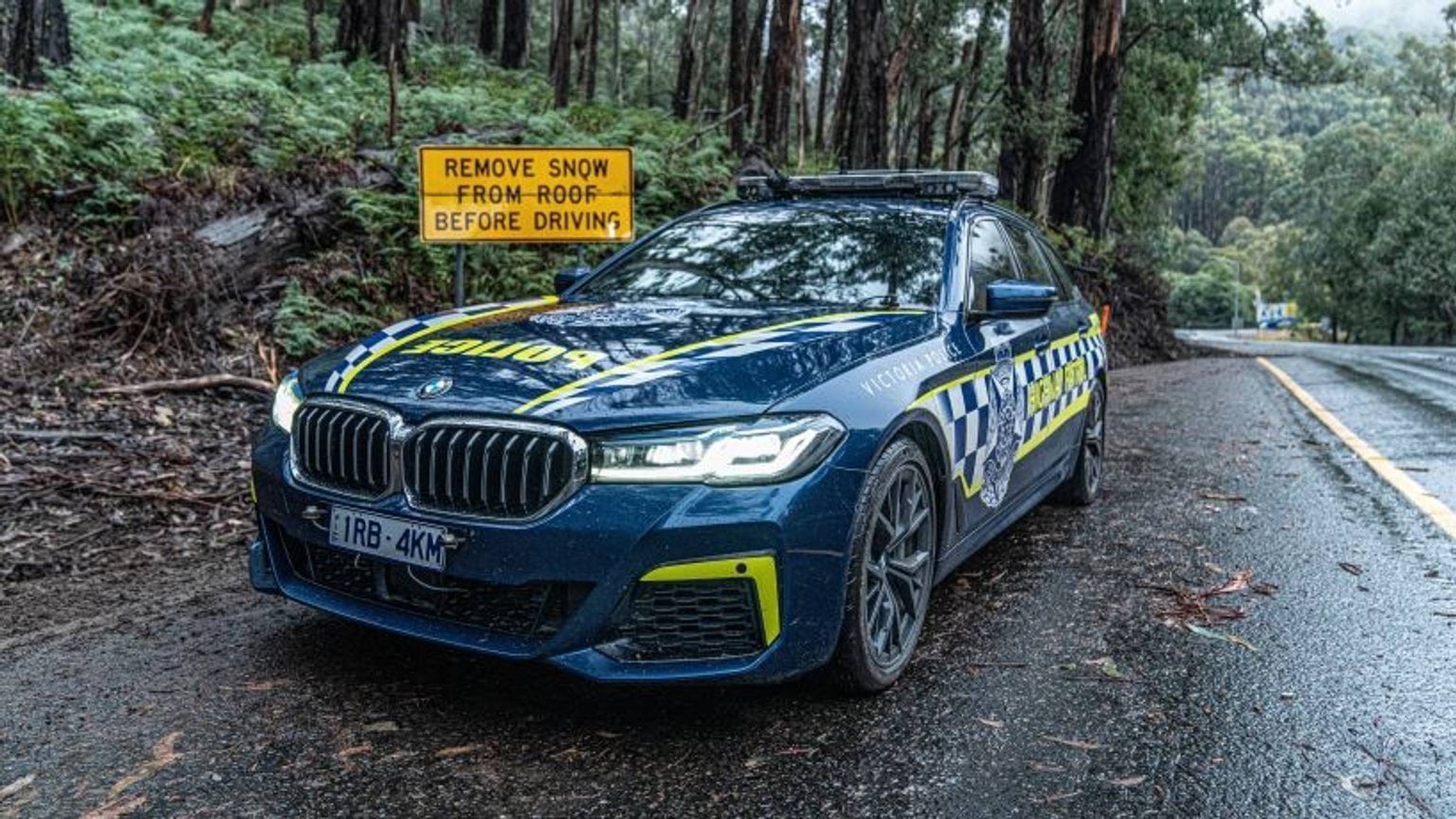Police car on wet roads.