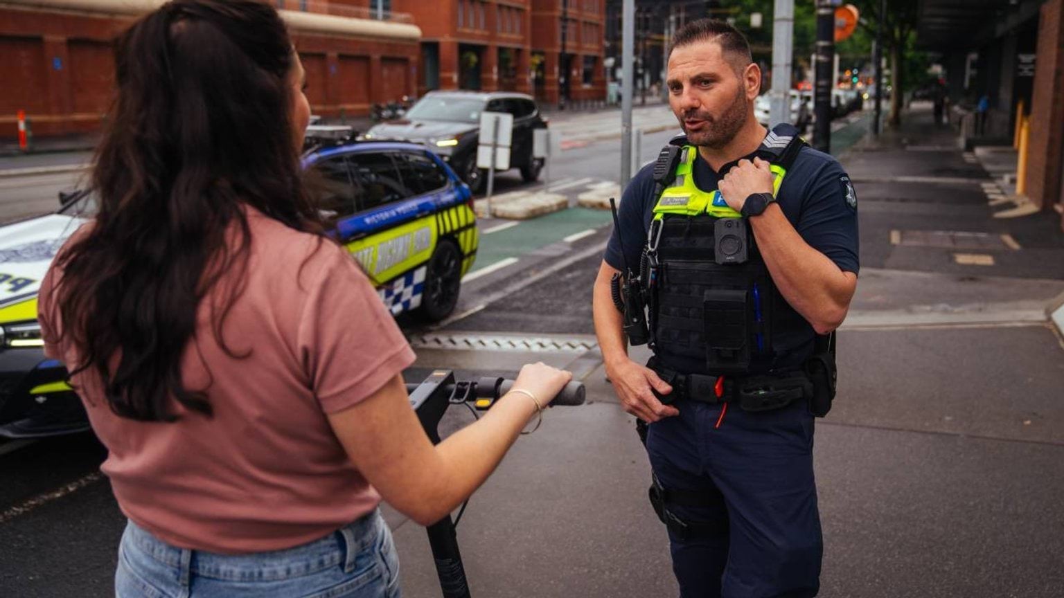 Police Life stories - Easy rider - member of public with an e-scooter talking to a police officer