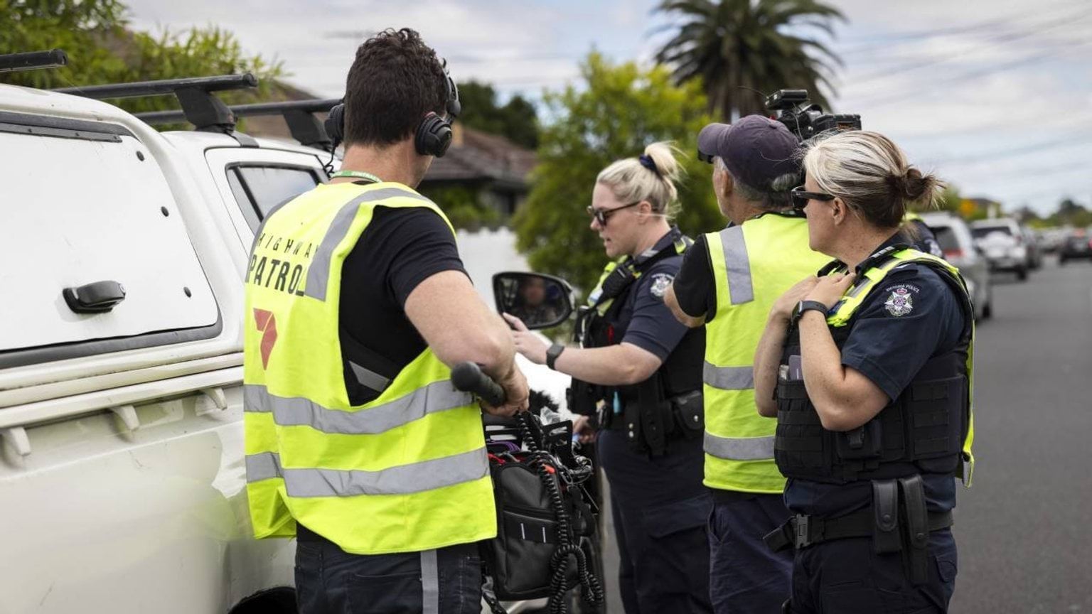 Police life stories - Filming of Highway Patrol - TV crew and police officers filming outside