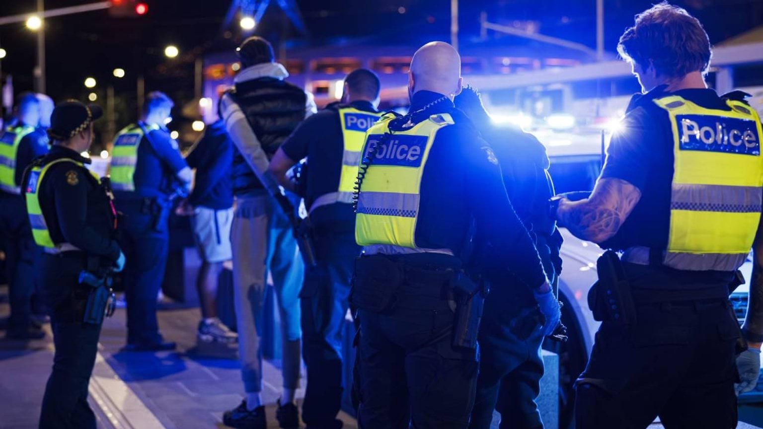 About us - Police Life stories - Staying safe all hours - a group of police officers engaging with public on a night out