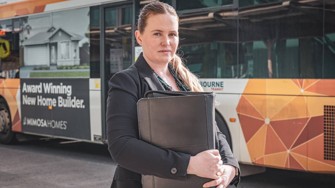 Police Life podcast - a young female detective in front of bus