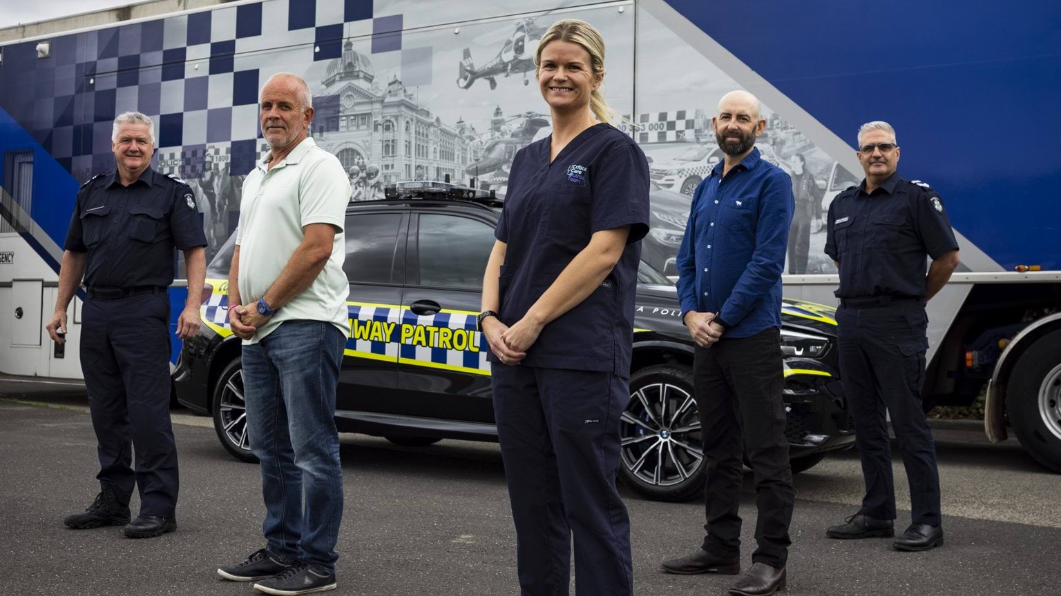 Police Life - image of give people standing in front of a highway patrol car