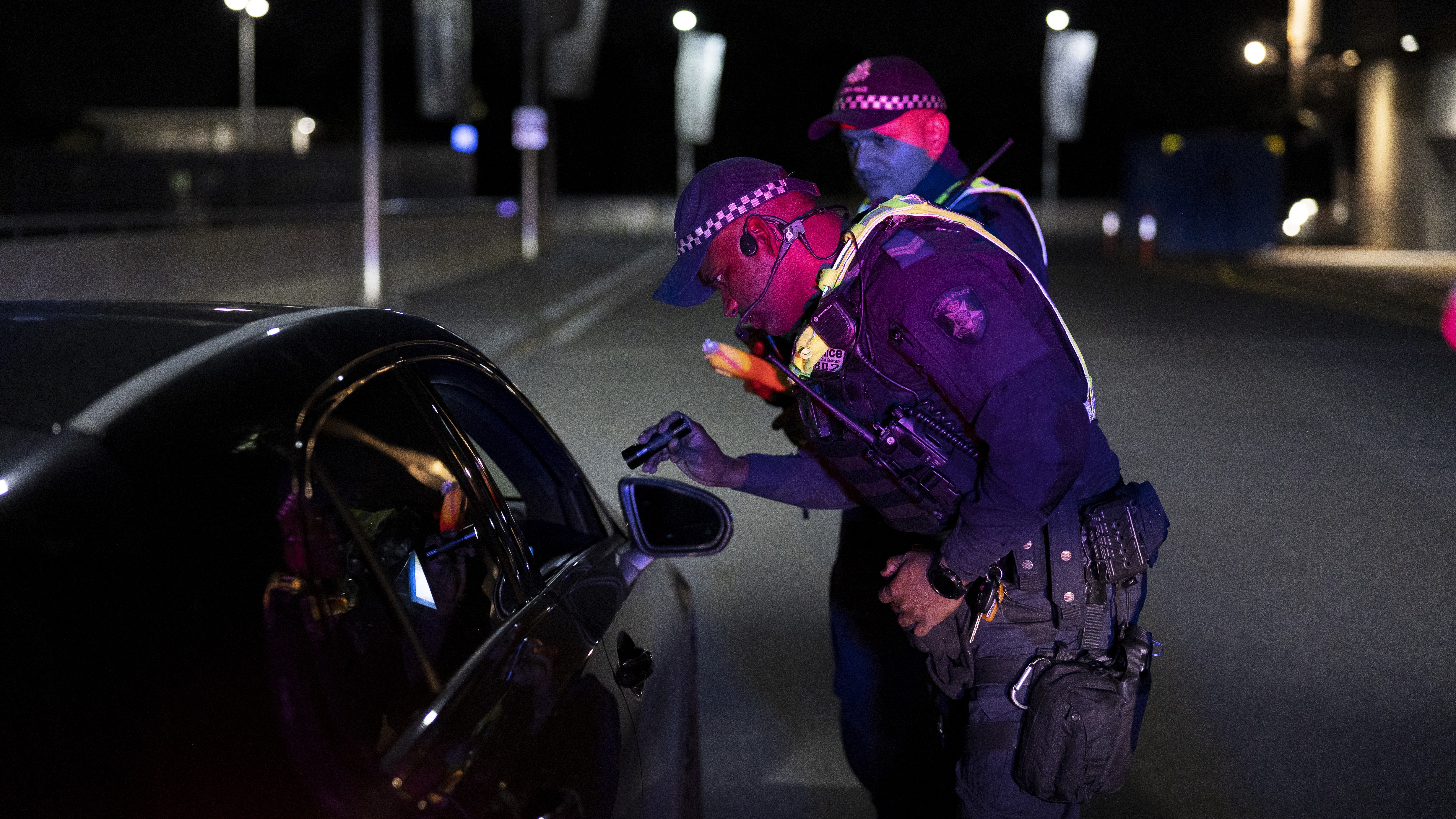 Police Life - A Public Order Response Team officer conducting a roadside breath test at night