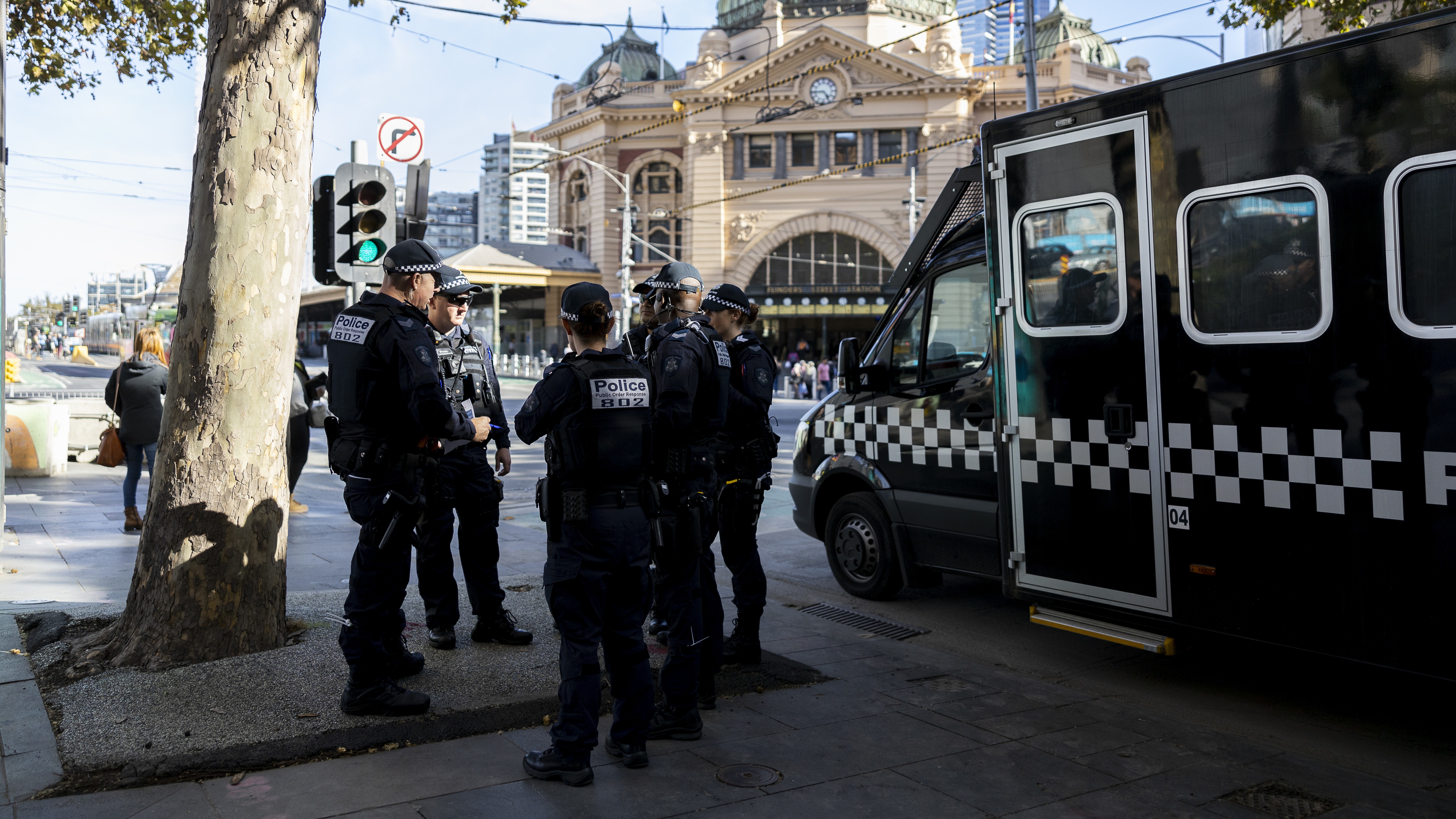 Police Life - A group of Public Order Response Team members standing on the footpath in front of Flinders Street Station