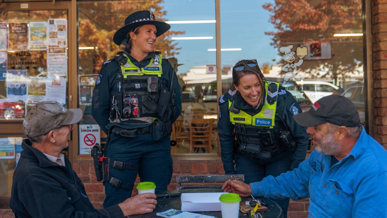 Two smiling female police officers talking to locals in Mansfield - 1280x720 - In-page.jpg