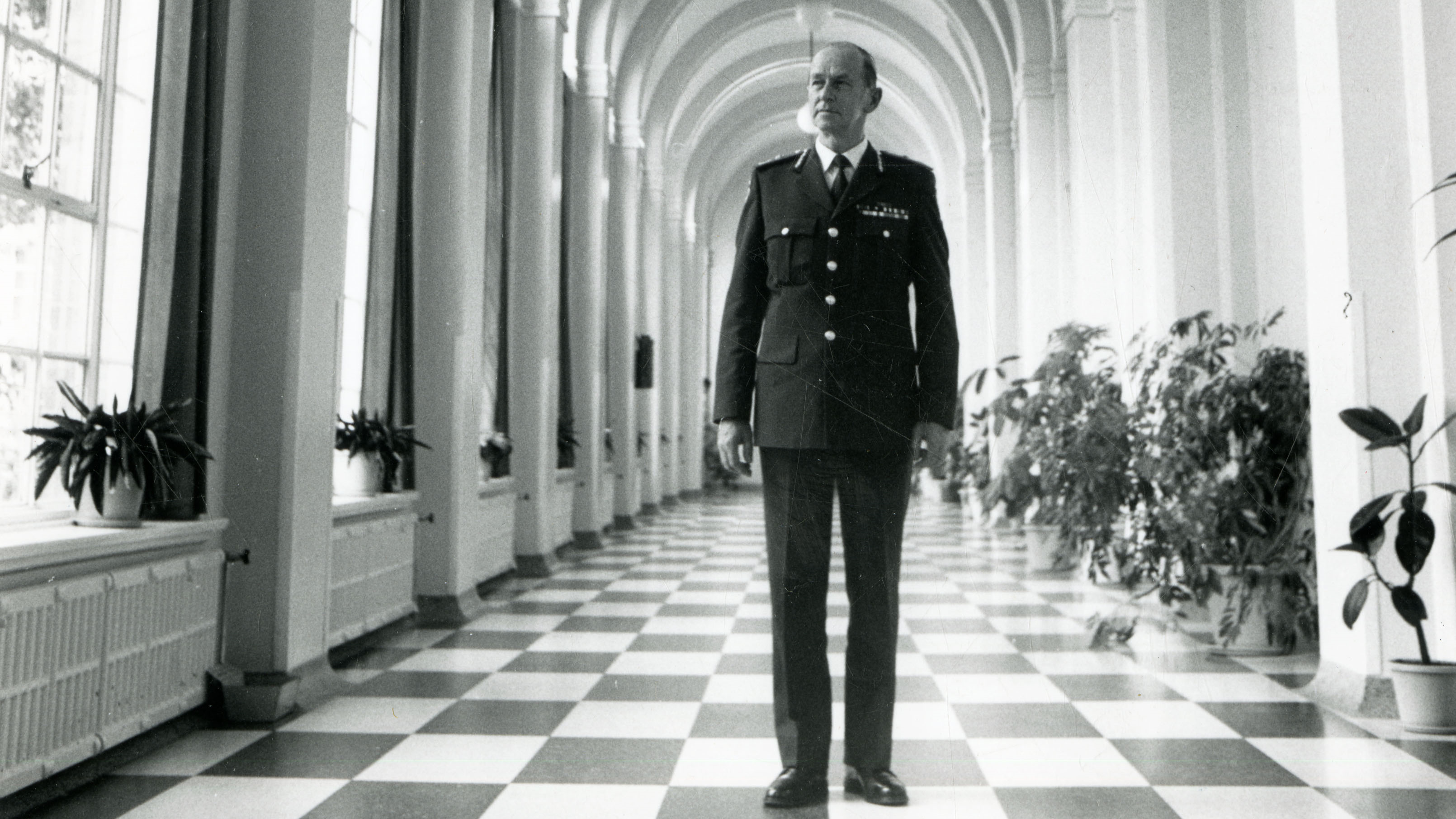 Police Life - Former Chief Commissioner Mick Miller in the expansive hallway of the Academy's main building.