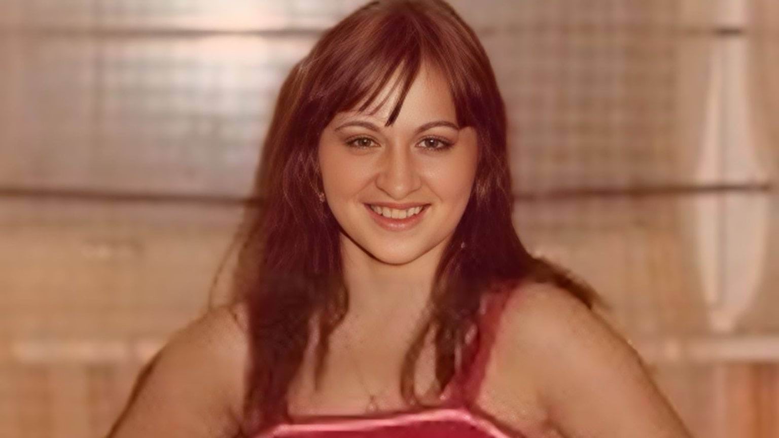 Haroula Kipouradou wearing a red top