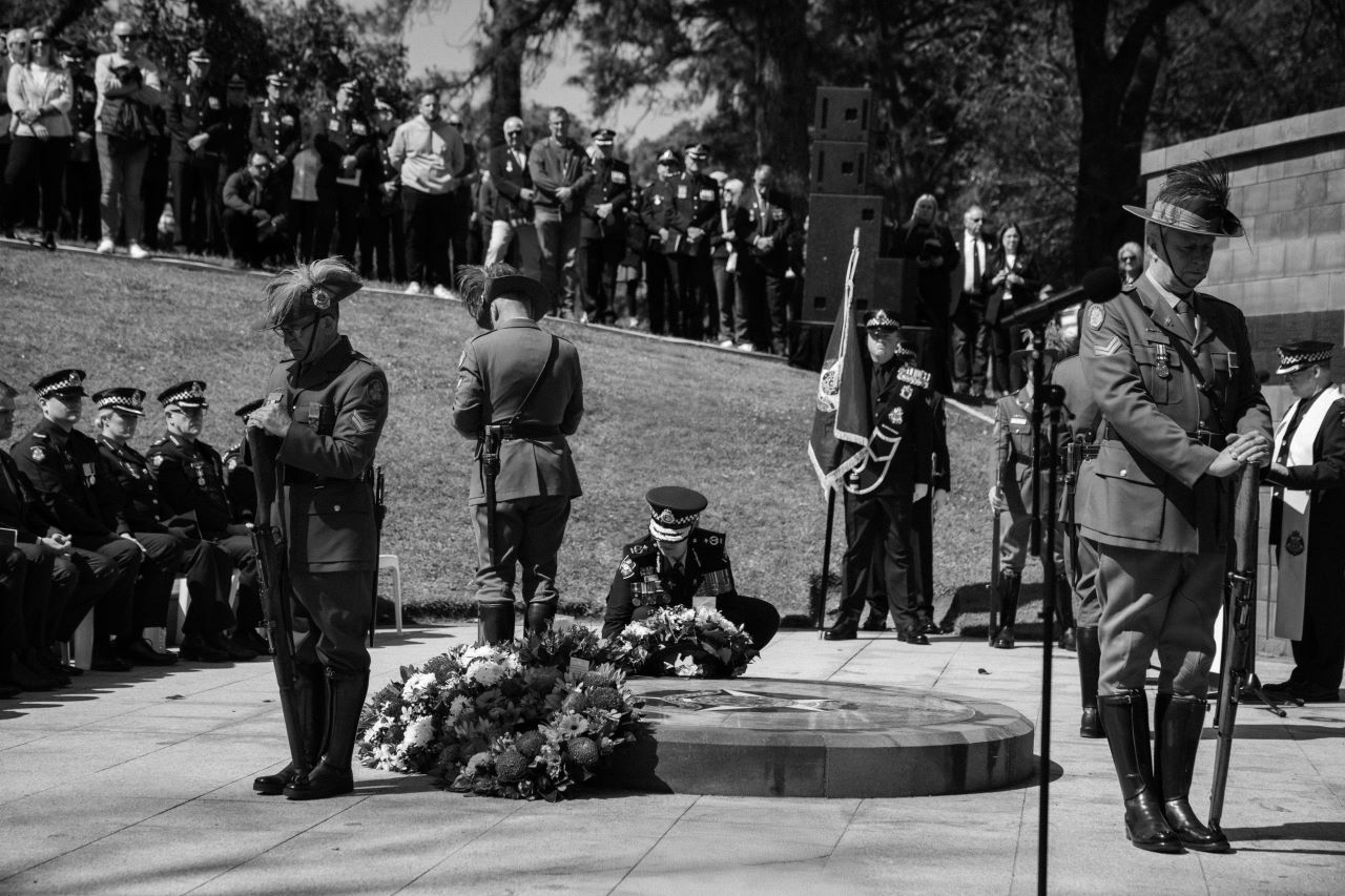 Officers laying wreaths at the Police Memorial.