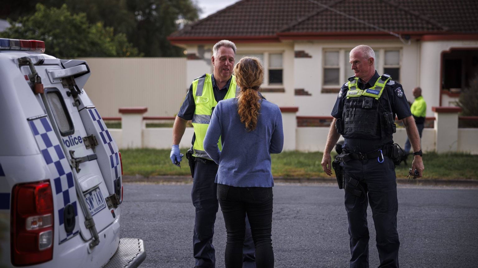 Police Life stories - Sgt Nigel MacDonald and Sgt Martin Nunn speak with community member on street - featured