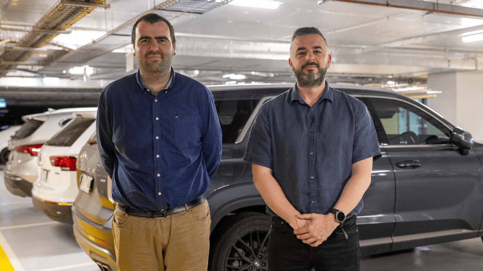 Police Life - Two employees standing in a carpark 