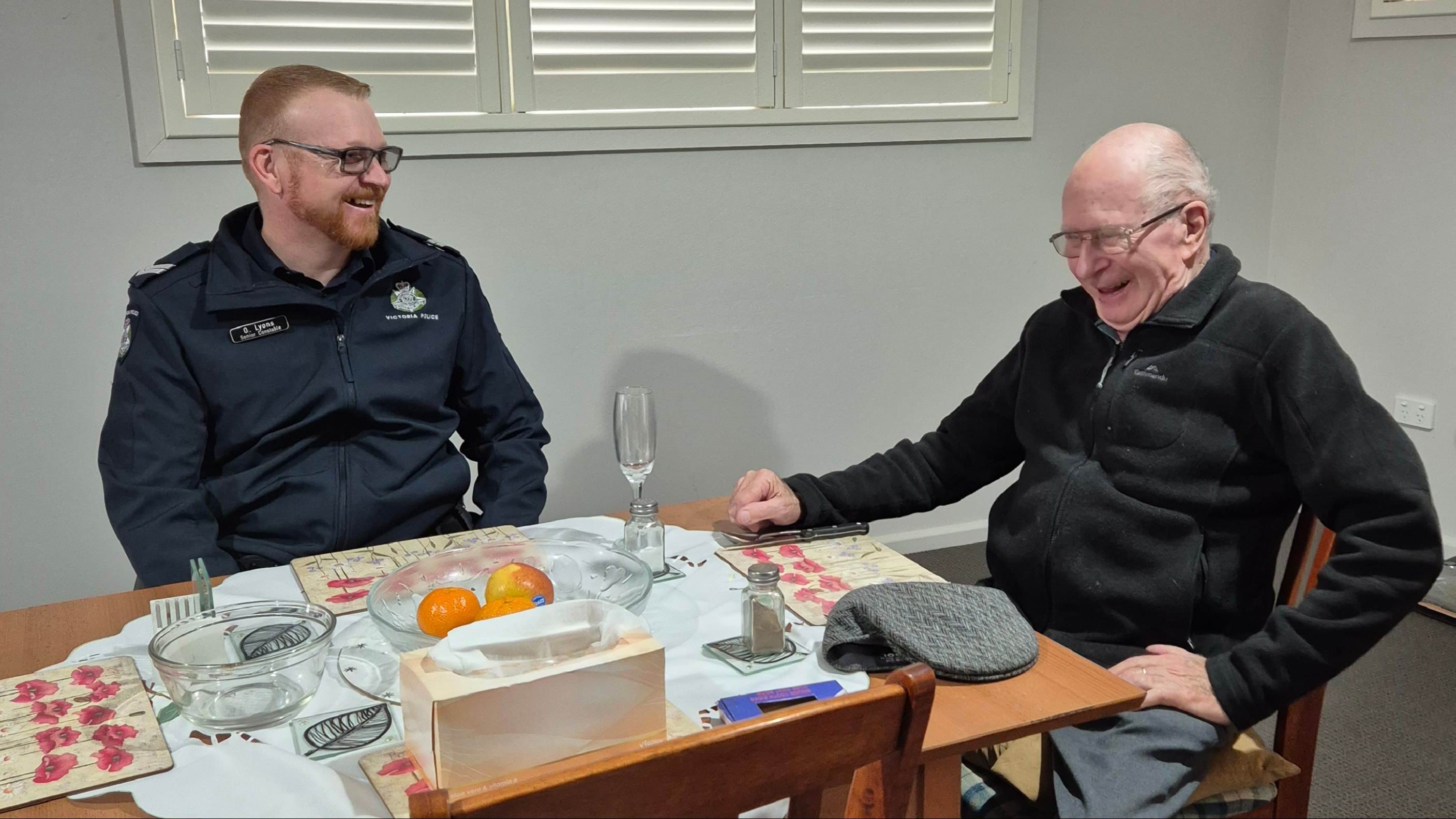 Police member sitting at a dining table with a Stawell local