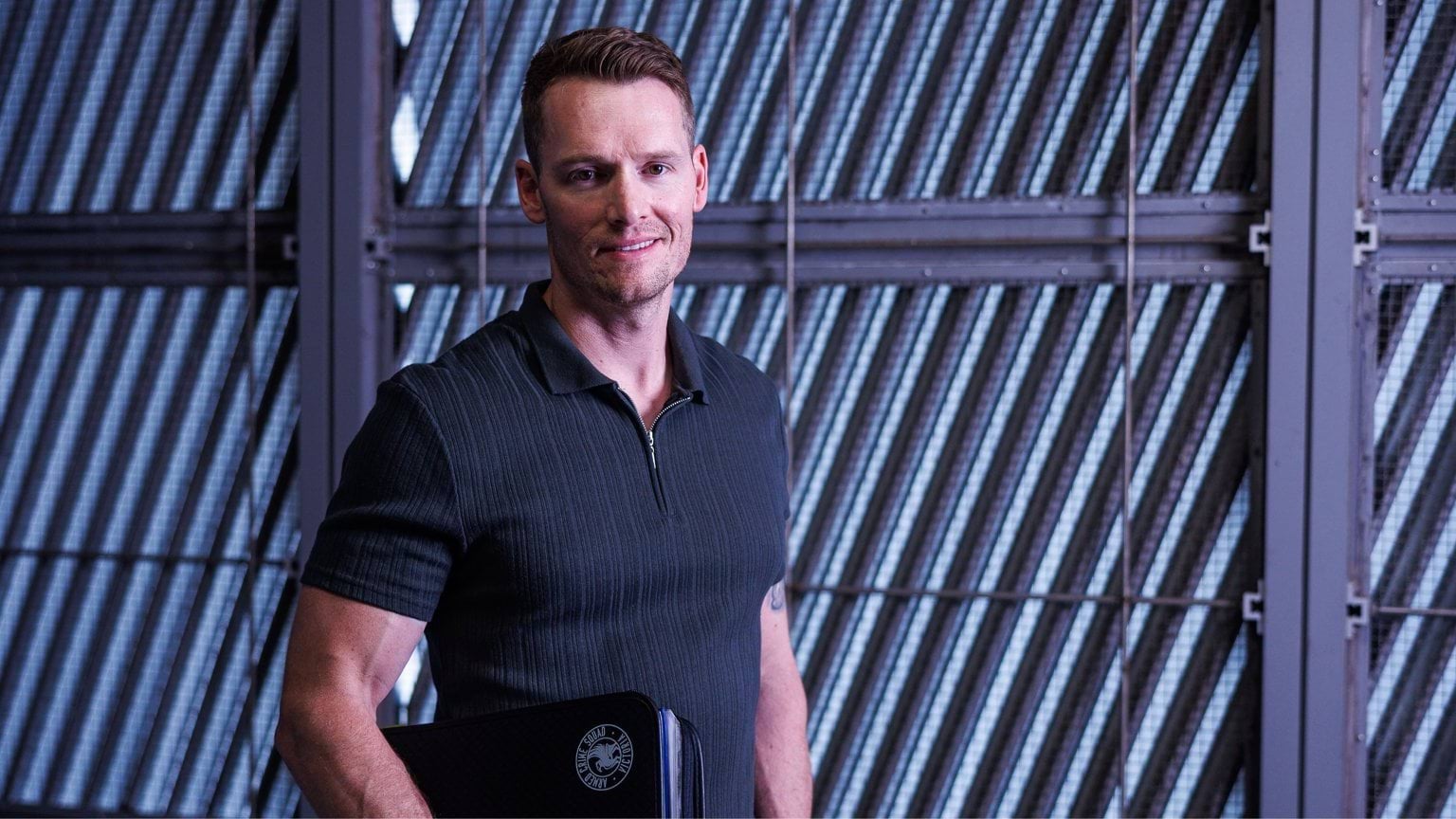 Male detective holding a folder