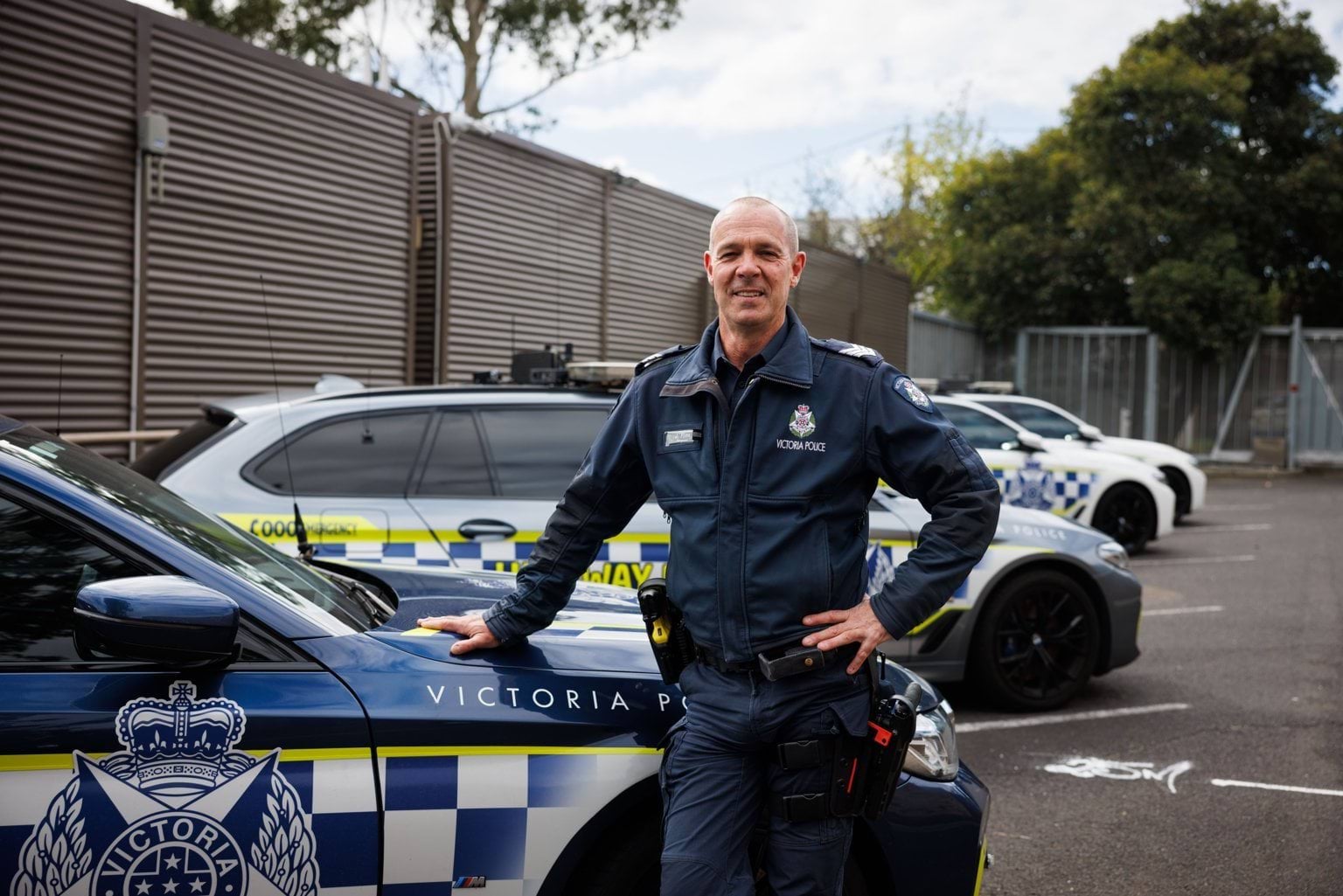 Sergeant Jason Flinn in front of police car