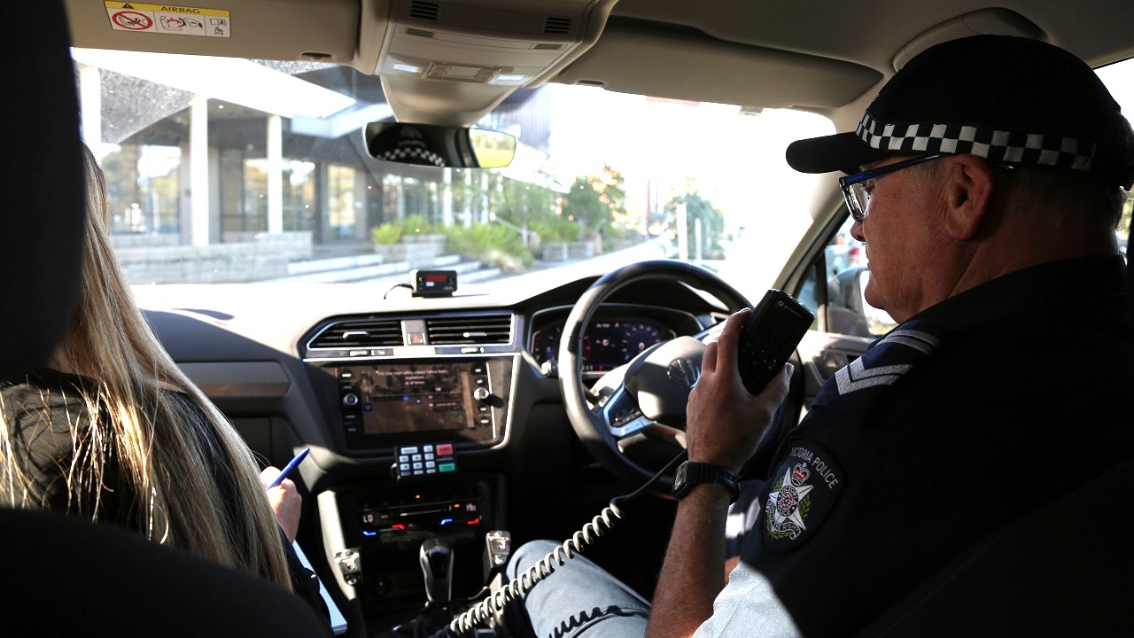 News - Police Life - Ldg Sen Const Smith in car with Ms Alborough