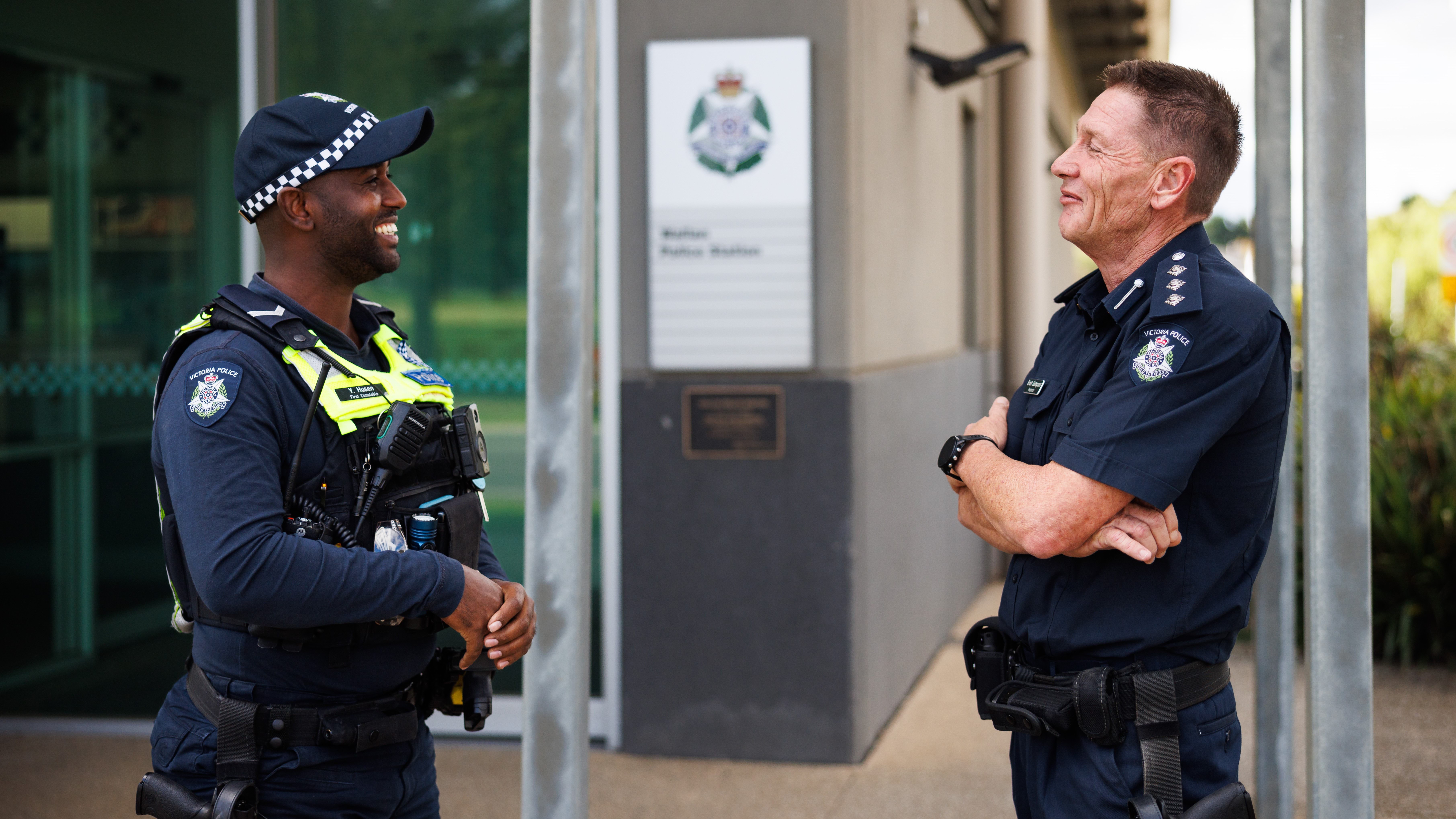 Two police members talking in front of Wallan Police Station