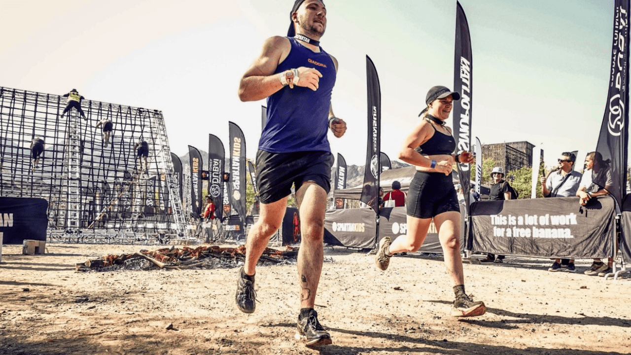 Police Life: Detective senior constables Mitch Lording and Megan Lewis, wearing running attire, compete in a Spartan obstacle race in the UAE.