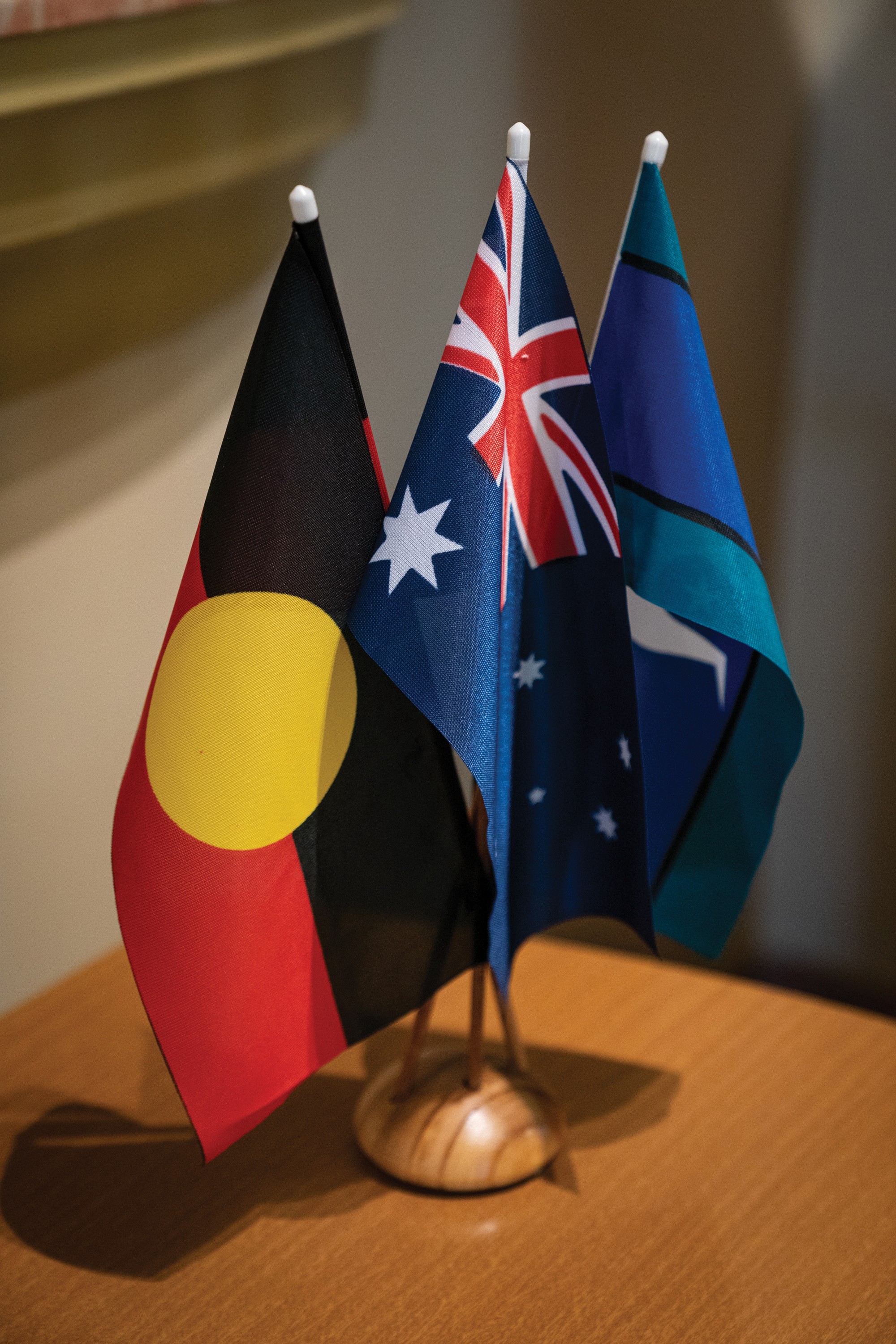 The Australian flag, the Aboriginal flag, and the Torres Strait Islander flag. 