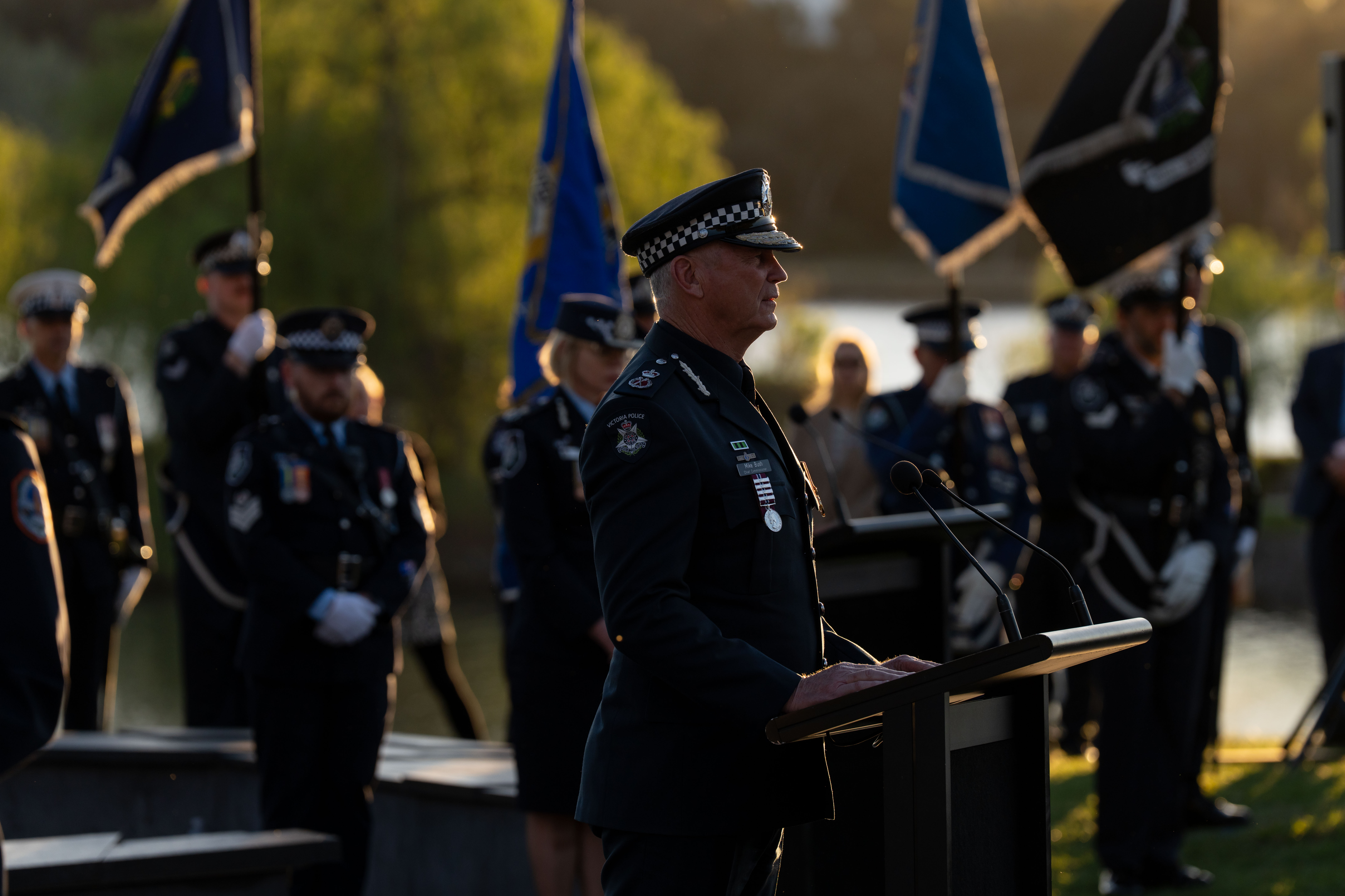 CCP Bush standing at podium speaking.